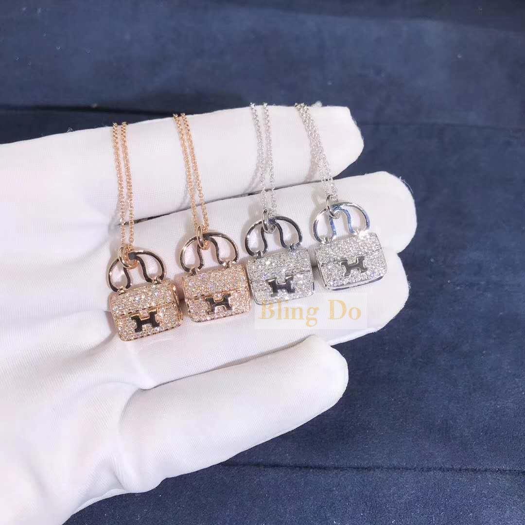 Hermes pendant in 18K gold set with 65 diamonds