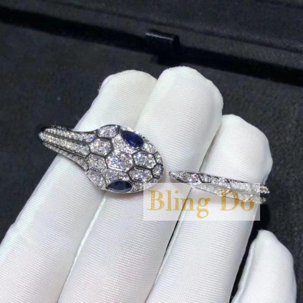 Bvlgari Serpenti bangle bracelet in 18 kt white gold set with blue sapphire eyes and pavé diamonds